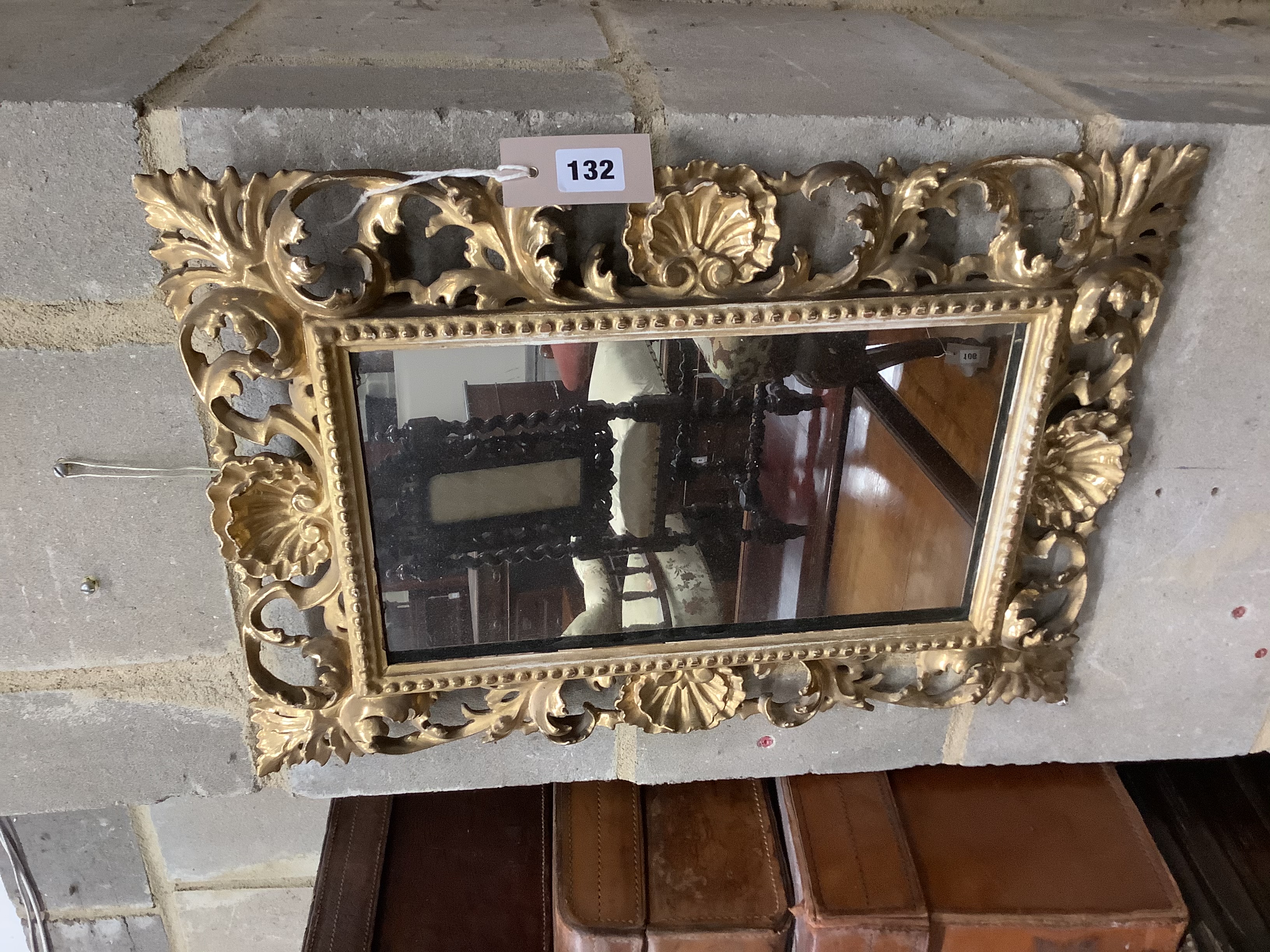 A Venetian foliate carved and pierced giltwood wall mirror, width 36cm, height 50cm 51.5 x 36.5cm